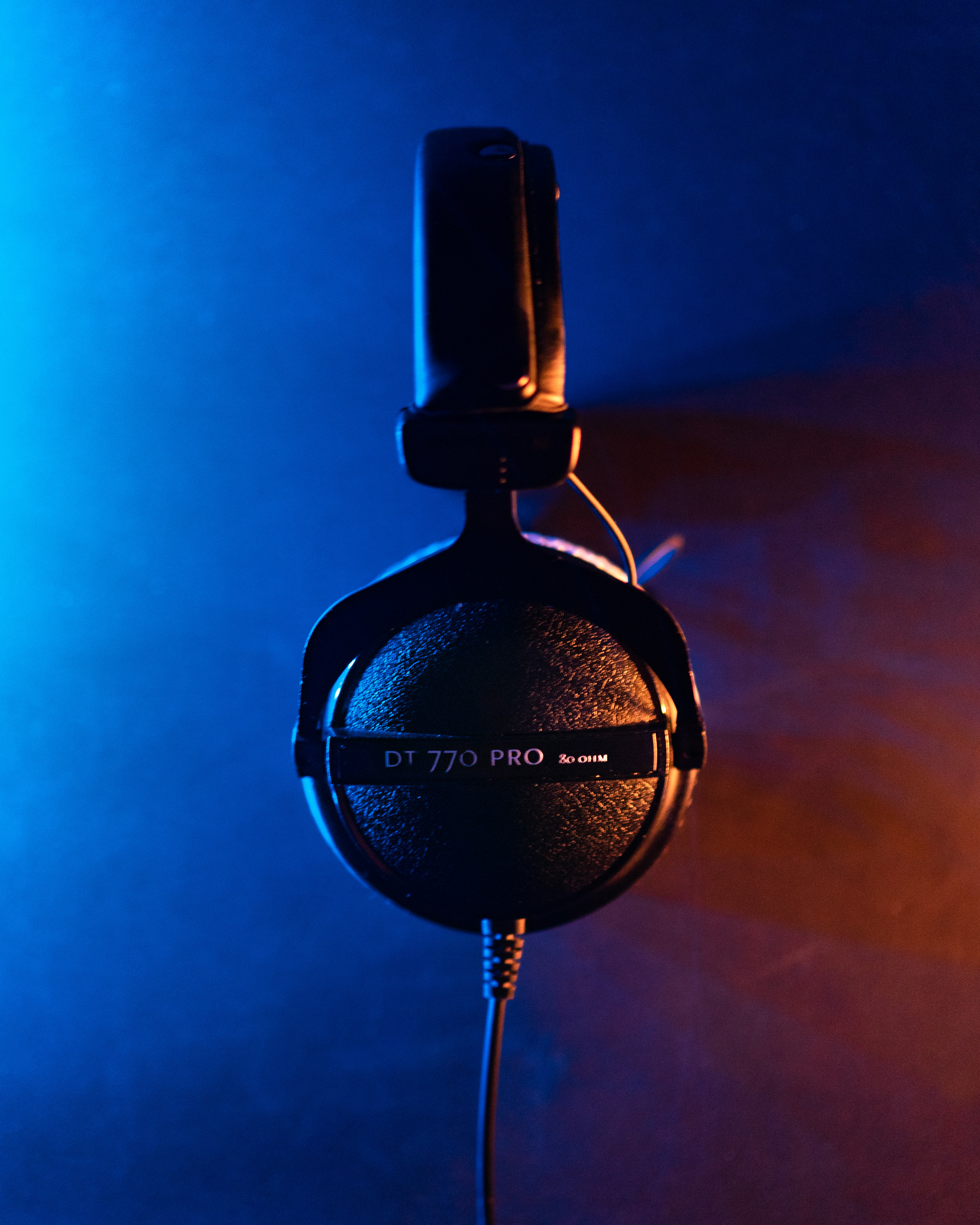 Black Headphones on Blue Background